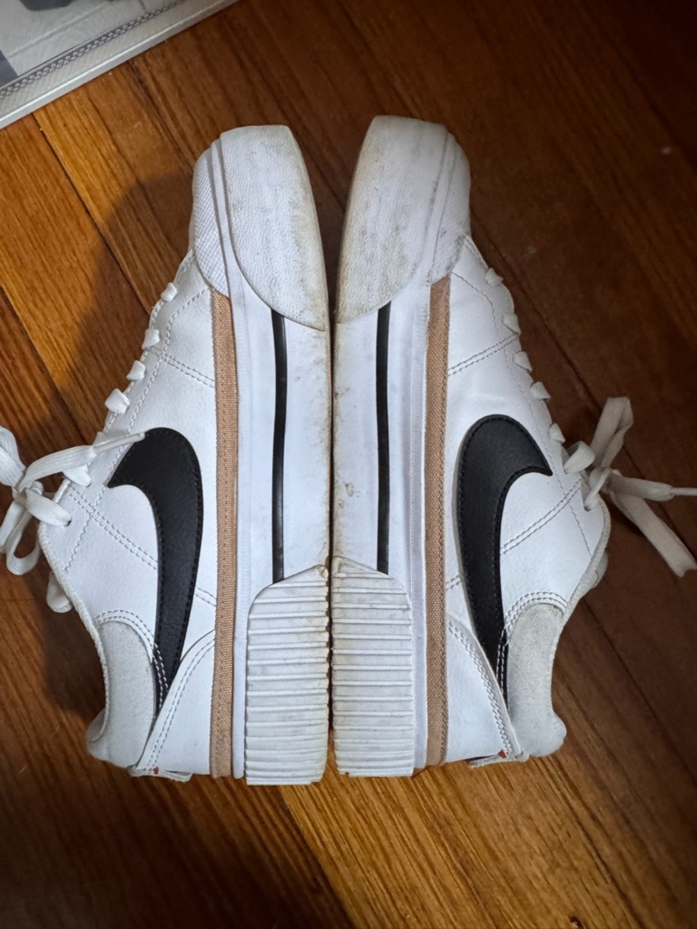 Nike women White Sneakers with Black Swoosh and Tan Stripe